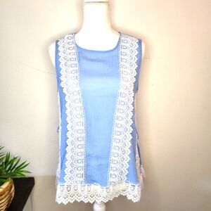 Blouse, sleeveless with white crochet trim.